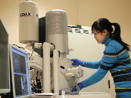 picture of a woman using lab equipment